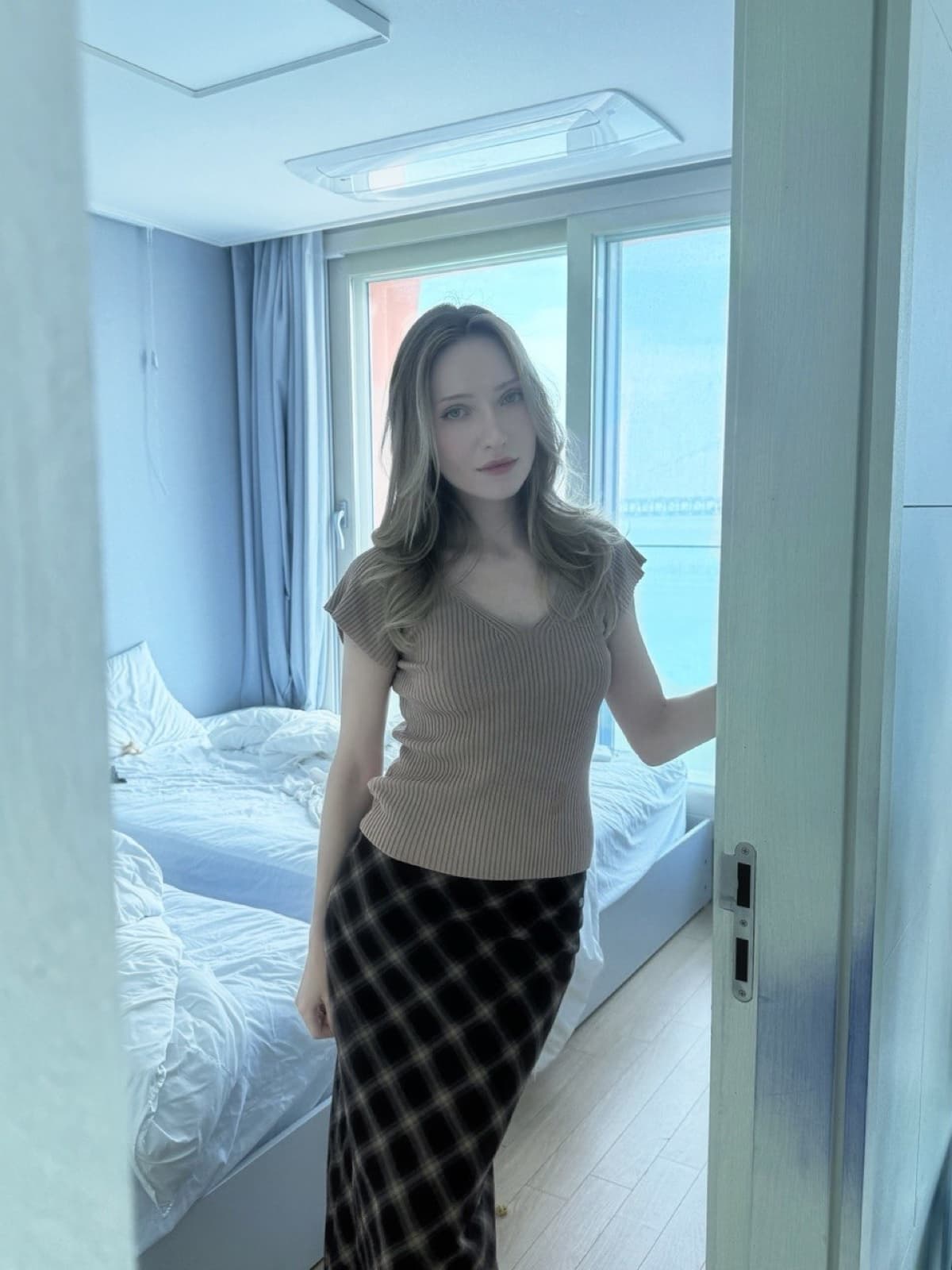 Stacey standing in a doorway