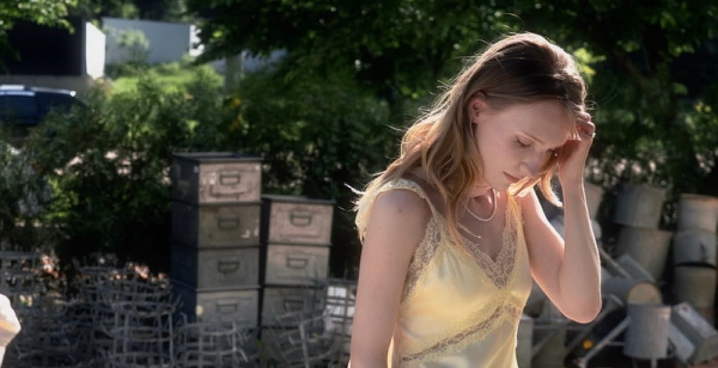 Stacey in a yellow dress, cinematic outdoor scene
